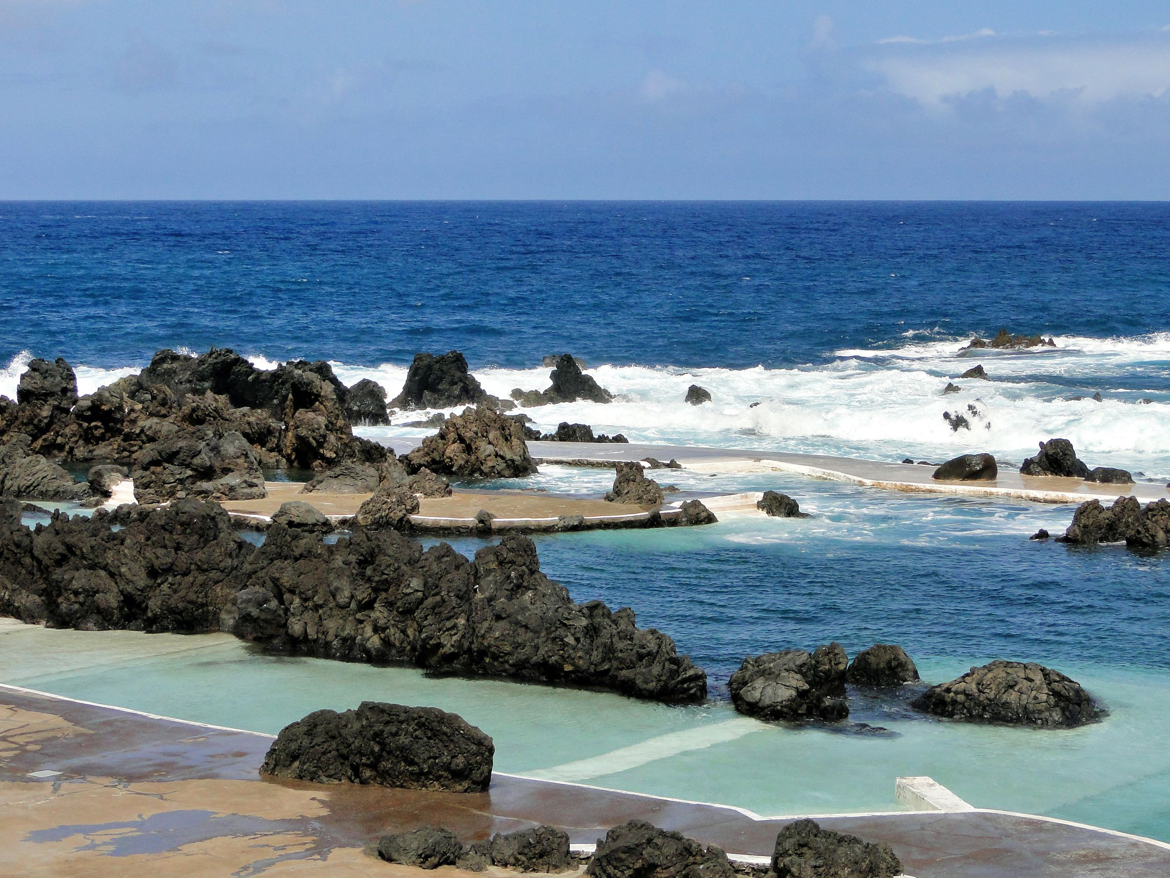 Volcanic natural pools of Porto Moniz in Madeira, turquoise water in black rock